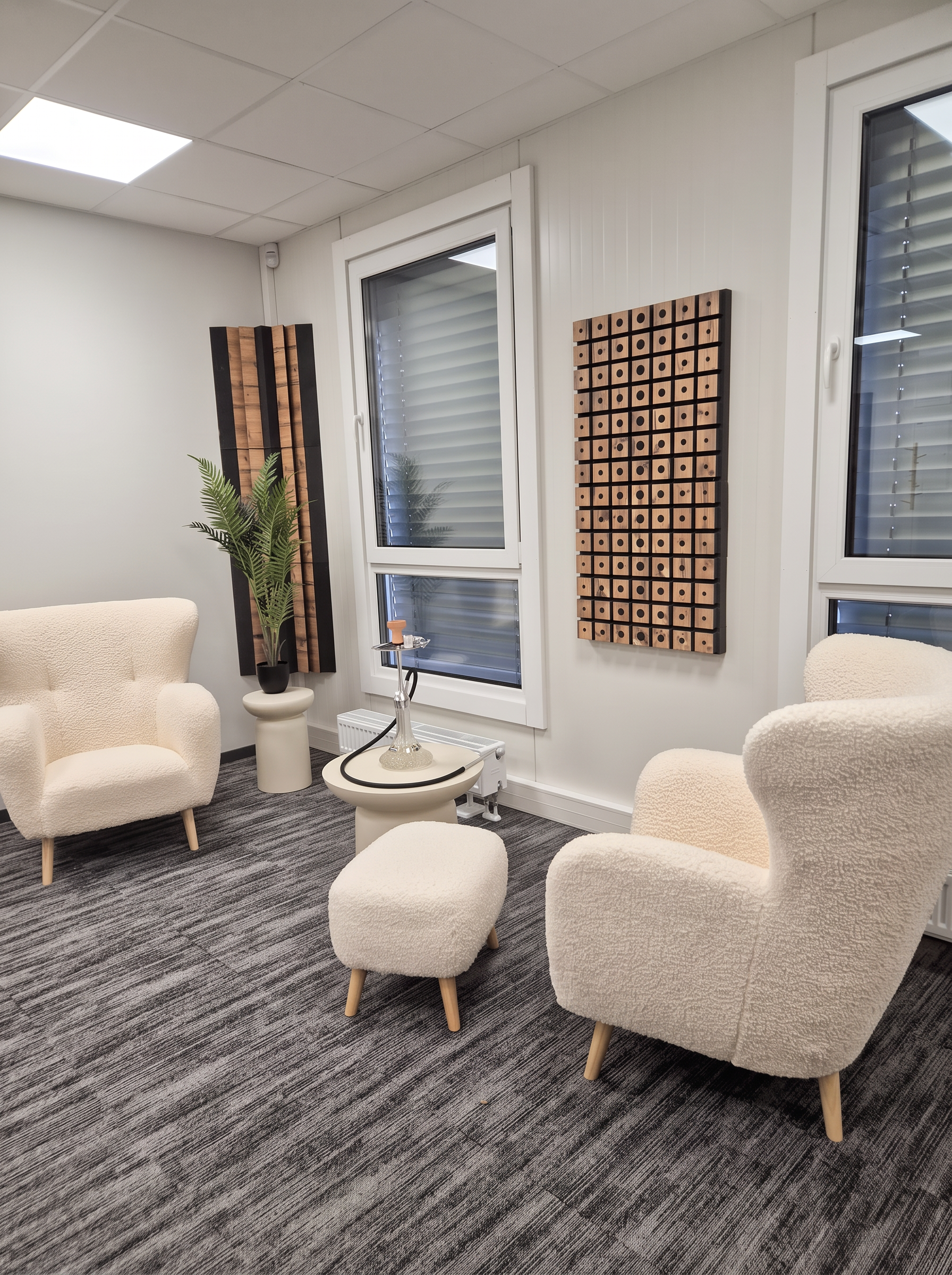 Private conversation area with two cream armchairs